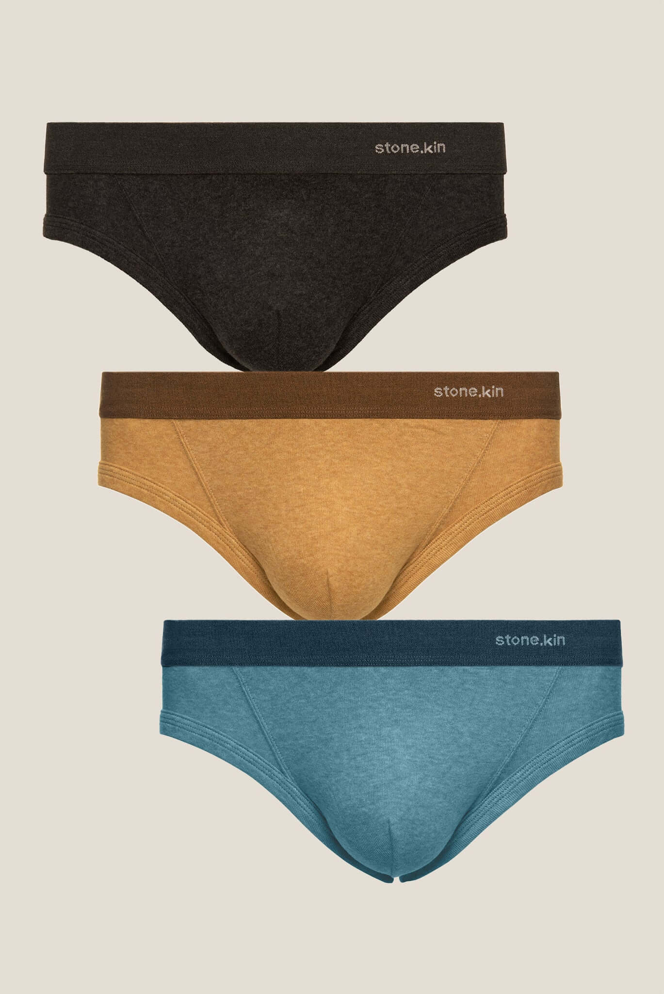 Stonekin Men's Organic Cotton Brief 3-Pack in Tar, Camel, and Lake colours, offering a sleek design and ultra-soft organic cotton for superior comfort.