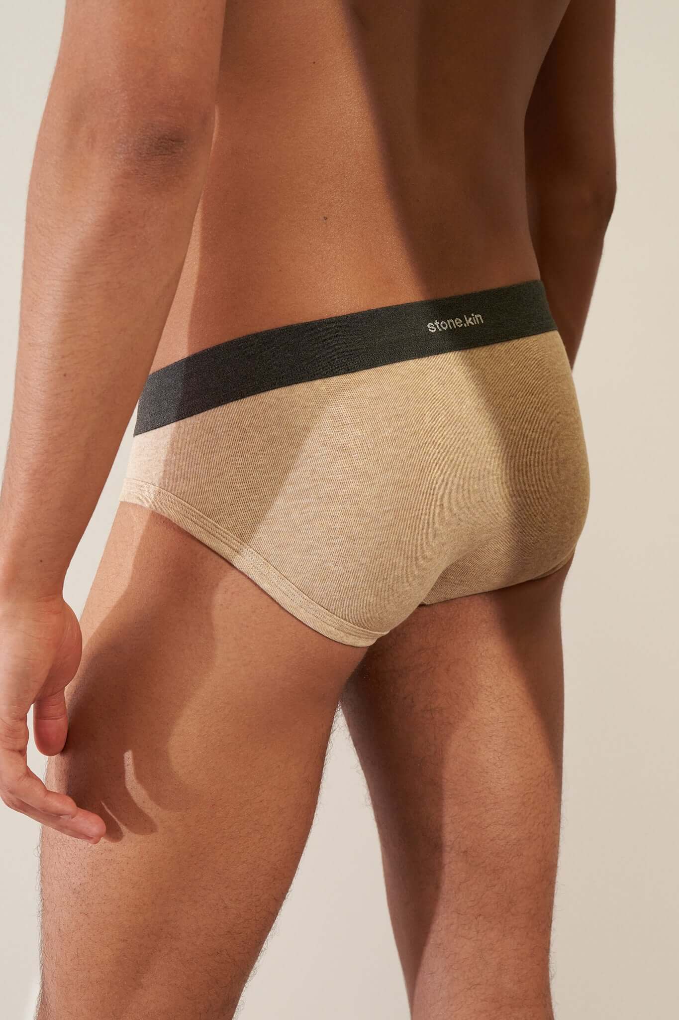 Stonekin Men's Organic Cotton Brief 3-Pack in Mustard, Sand, and Tar colours, designed for a comfortable fit with soft organic cotton fabric.