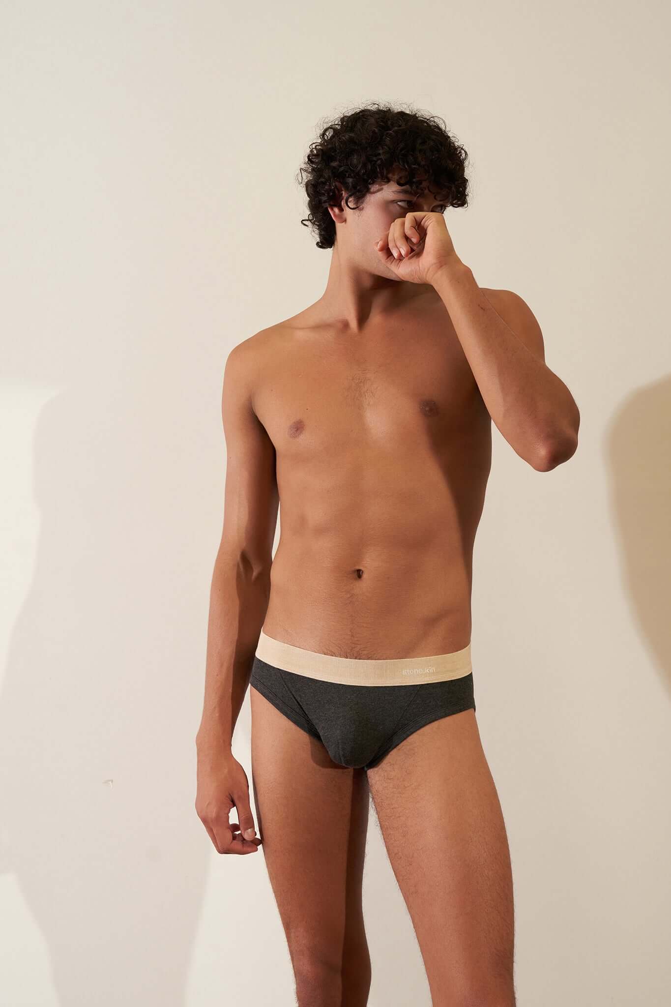 Stonekin Men's Organic Cotton Brief 3-Pack in Mustard, Sand, and Tar colours, designed for a comfortable fit with soft organic cotton fabric.