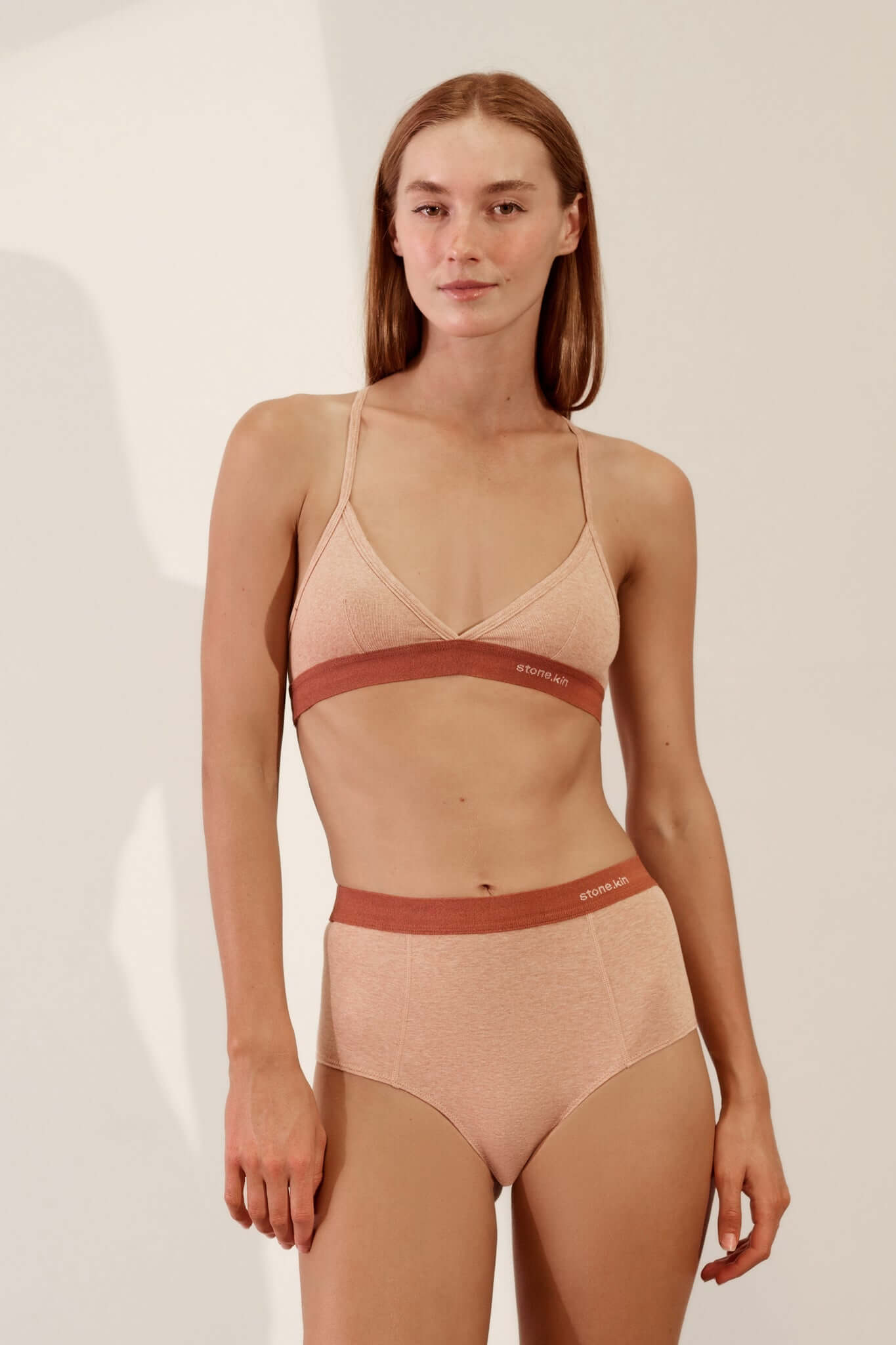 Stone.kin Women's Organic Cotton Rib Hi Brief in Nude and Rust colours, offering comfort and breathability. Ethically made from soft, sustainable organic cotton.