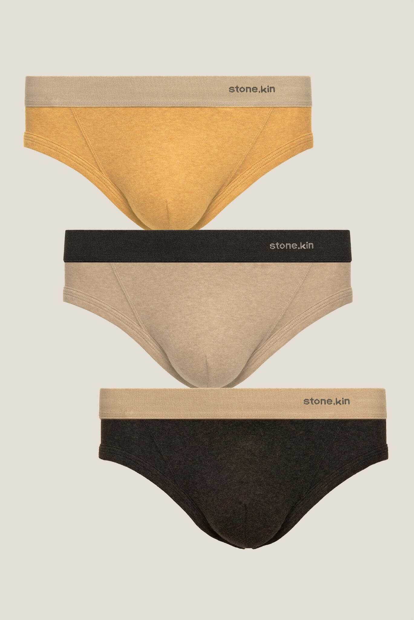 Stonekin Men's Organic Cotton Brief 3-Pack in Mustard, Sand, and Tar colours, designed for a comfortable fit with soft organic cotton fabric.